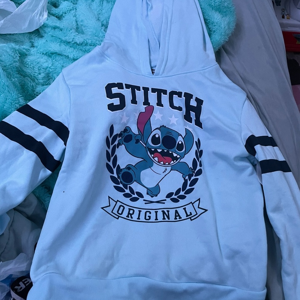 an xl stitch light blue with black stripes hoodie it is for kids polyester